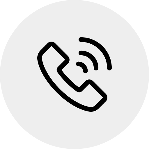 Black icon of a classic telephone handset with three curved lines indicating sound or signal, suggesting a phone call, on a light gray circular background.