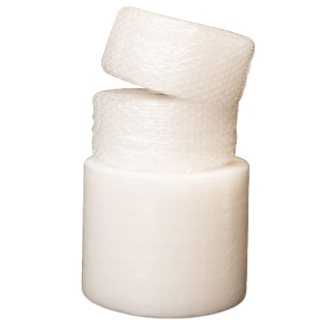 Two rolls of clear bubble wrap are stacked on top of a larger roll of plain white foam, all set against a plain white background.